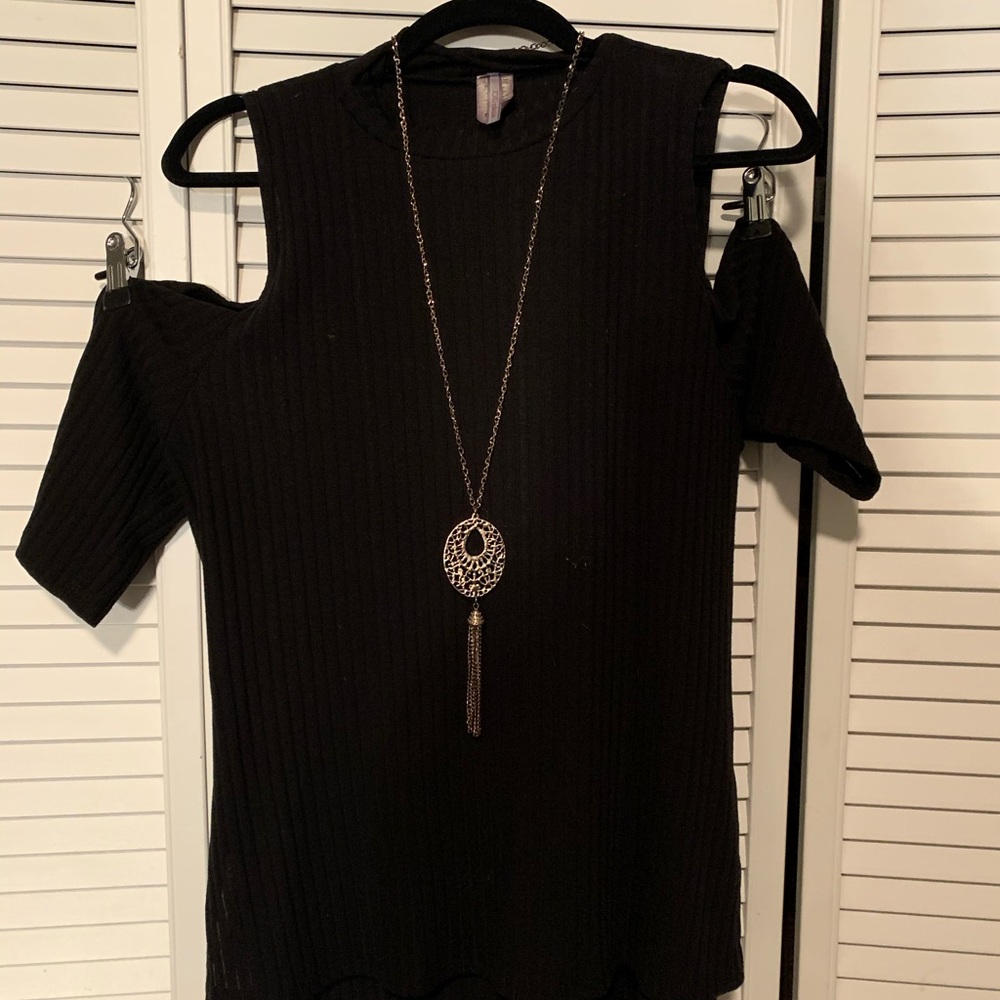 Black turtle neck, open shoulder shirt